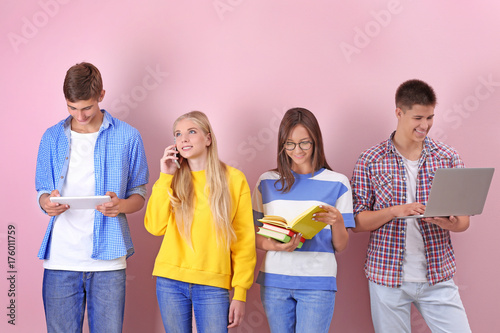 Teenagers with gadgets and ...