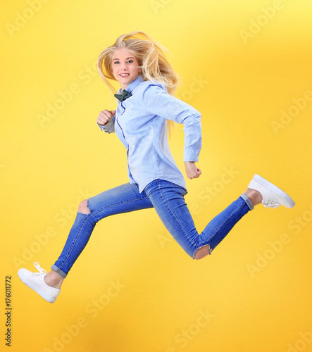 Jumping teenager girl on co...