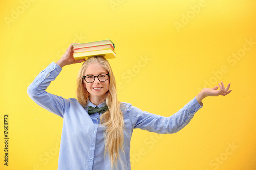 Teenager girl with books on...