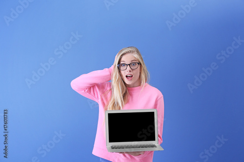 Teenager girl with laptop o...