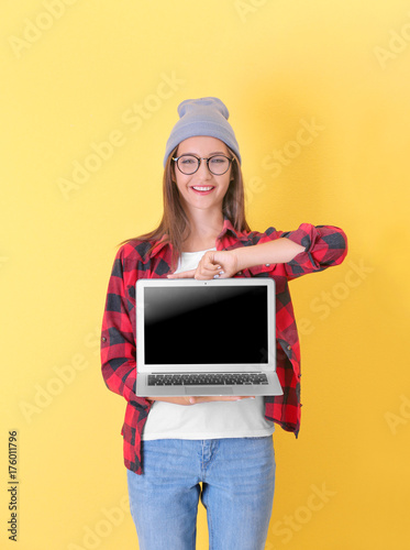 Teenager girl with laptop o...