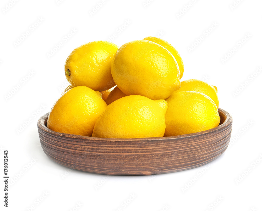 Wooden plate with ripe yellow lemons on white background Wooden plate with ripe yellow lemons on white background