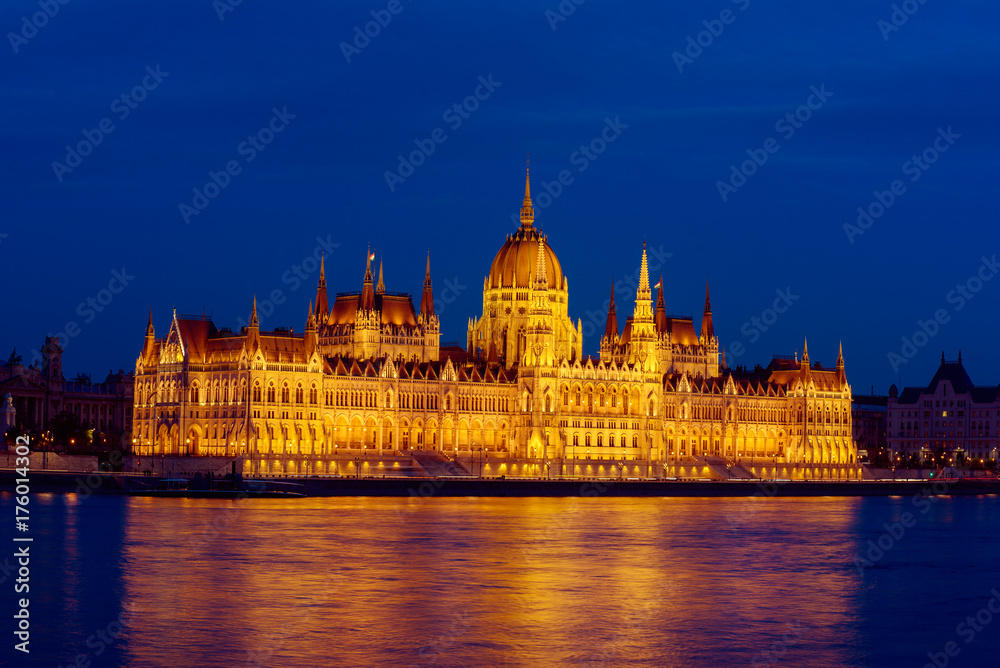 Budapest Parliament building and Danube river at night with illumination, travel sightseeing background