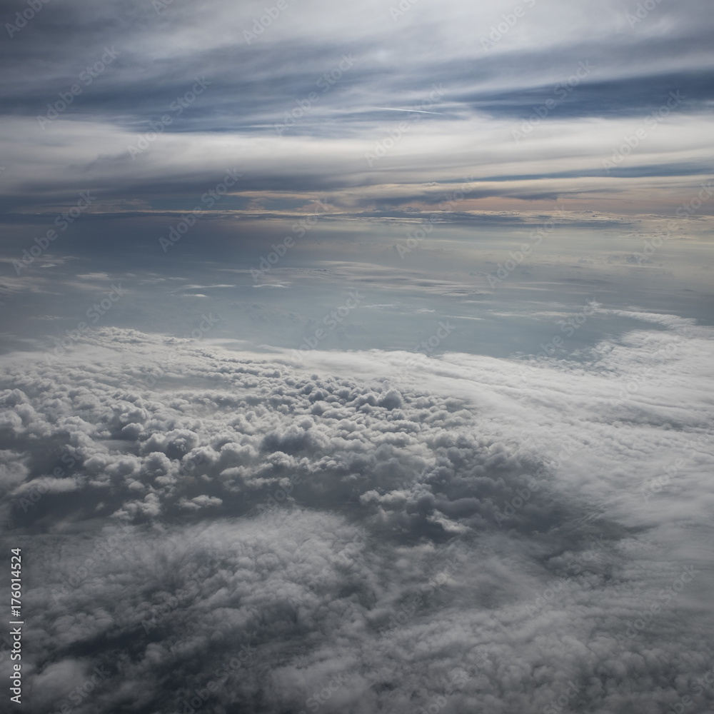 Beautiful clouds before sunset from the airplane cloudscape