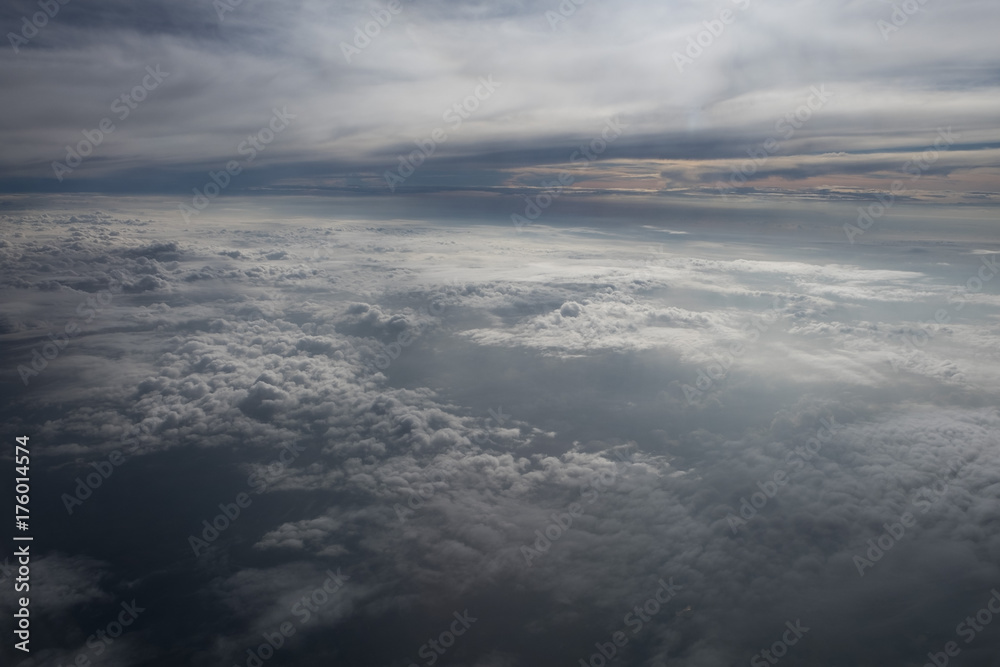 Beautiful clouds before sunset from the airplane cloudscape