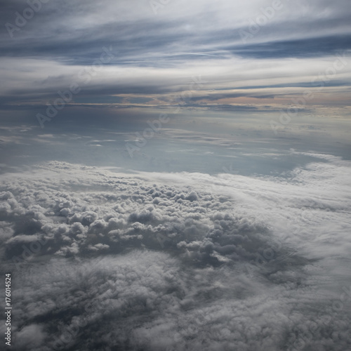 Beautiful clouds before sunset from the airplane cloudscape © Viktorie