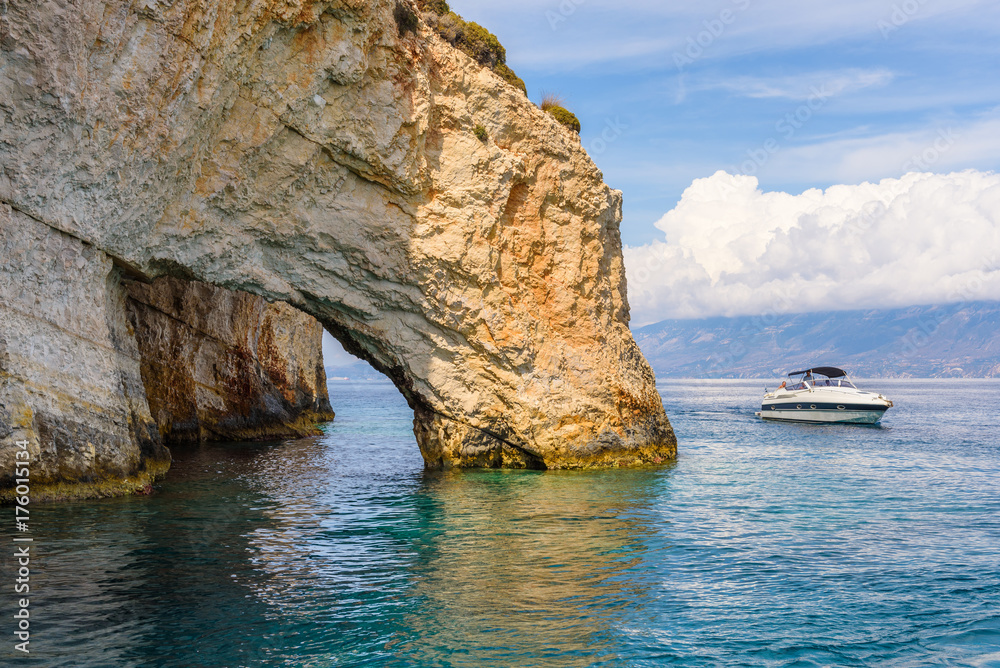 Famous Blue Caves and crystal sea waters of the bay near Skinari Cape. Zakynthos Island, Greece.