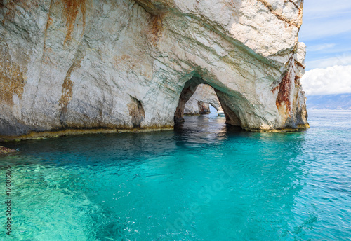Famous Blue Caves and crystal sea waters of the bay near Skinari Cape. Zakynthos Island, Greece.