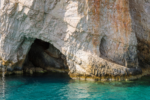 Famous Blue Caves and crystal sea waters of the bay near Skinari Cape. Zakynthos Island, Greece. © vivoo