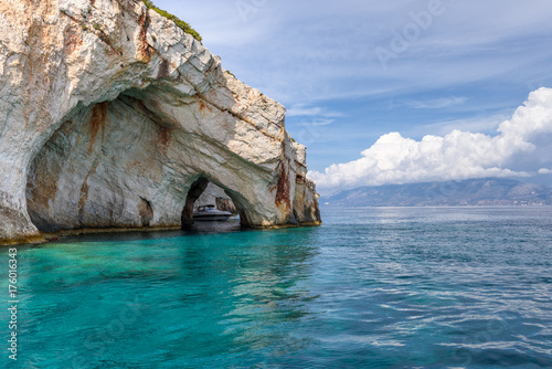 Famous Blue Caves and crystal sea waters of the bay near Skinari Cape. Zakynthos Island, Greece.