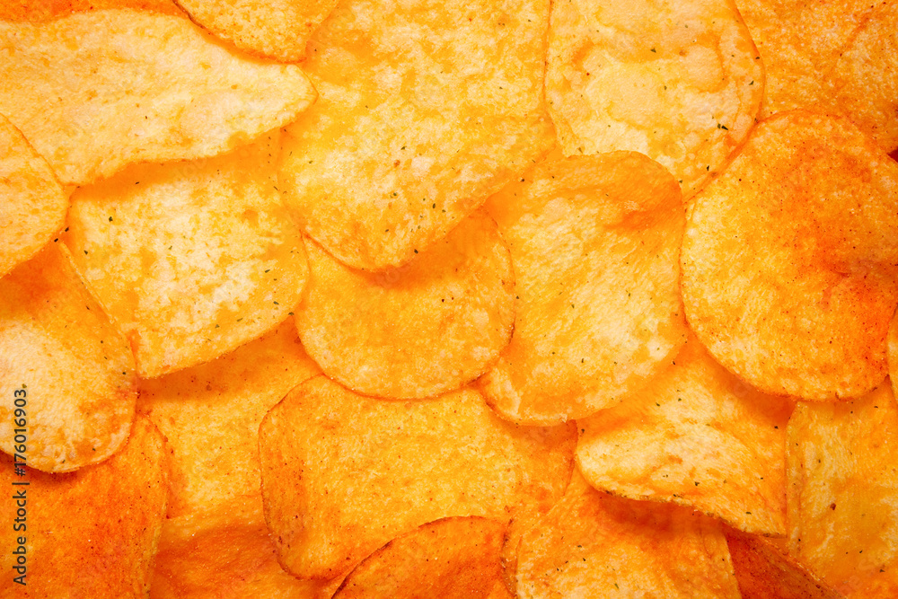 Golden Chips potato texture. Food Background of delicious chips Golden Chips potato texture. Food Background of delicious chips