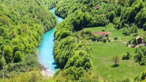 Scenic deep canyon with blue Tara river in Montenegro mountains. Mountain river Tara close up.