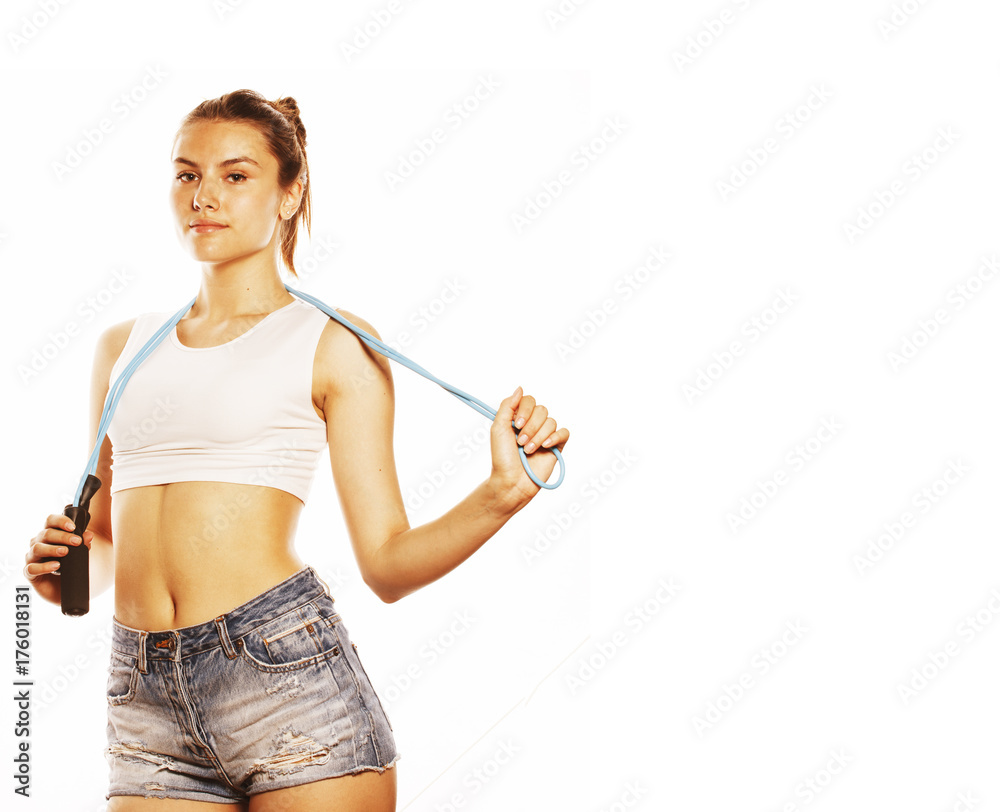 young pretty woman with skipping rope isolated on white young pretty woman with skipping rope isolated on white