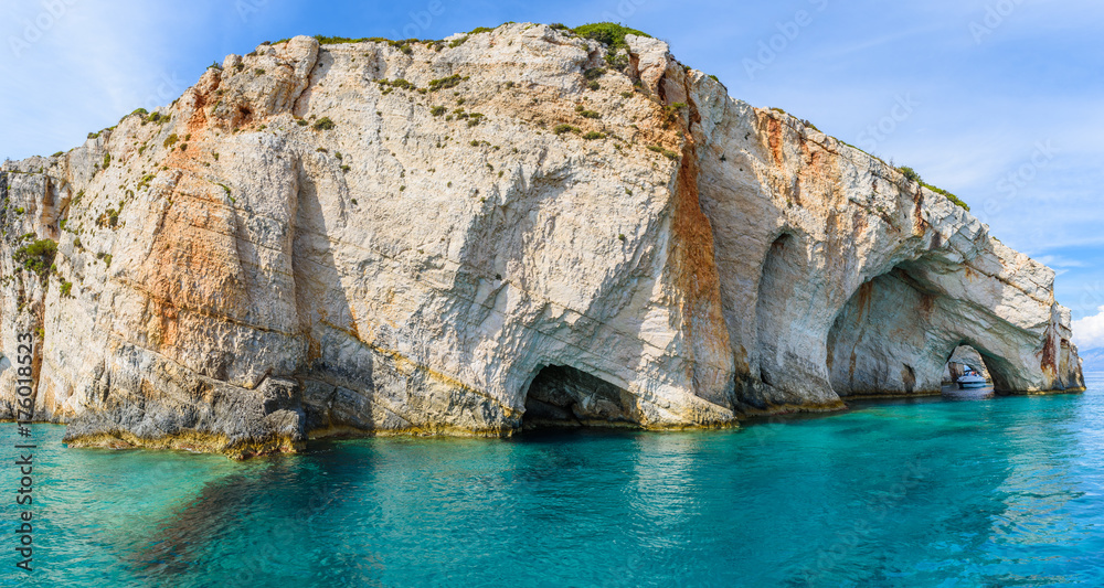 Famous Blue Caves and amazing rocks near Skinari Cape. Zakynthos Island, Greece.