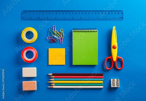 Schools supplies on a Blue Background