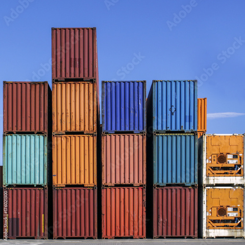 Stacked cargo containers in storage area of freight sea port terminal