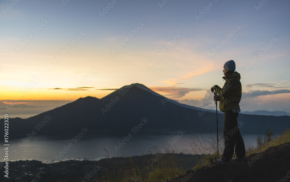 Hiker on top of Mt Batur, Bali, Indonesia Hiker on top of Mt Batur, Bali, Indonesia