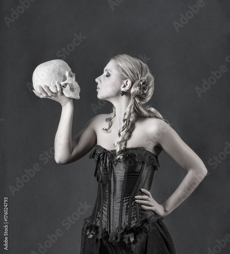 Beautiful blonde with a skull face to face