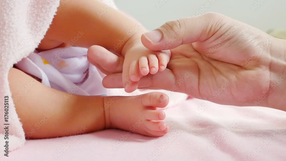 nice mum touching take care to her baby feet in cradle, motherhood caress to happy dreams. concept of happy house in snugness. healthcare comfortable children nice mum touching take care to her baby feet in cradle, motherhood caress to happy dreams. concept of happy house in snugness. healthcare comfortable children