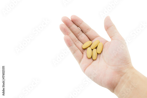 A hand of a man with some pills on white background, clipping part