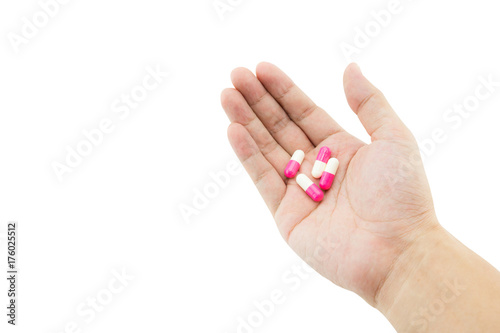 A hand of a man with some capsule pills on white background, clipping part