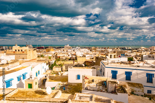 Slika na platnu Cityscape of Sousse at dramatic sunset with blue skies and clouds