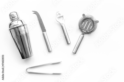 Barman equipment. Shaker, strainer on white background top view copyspace