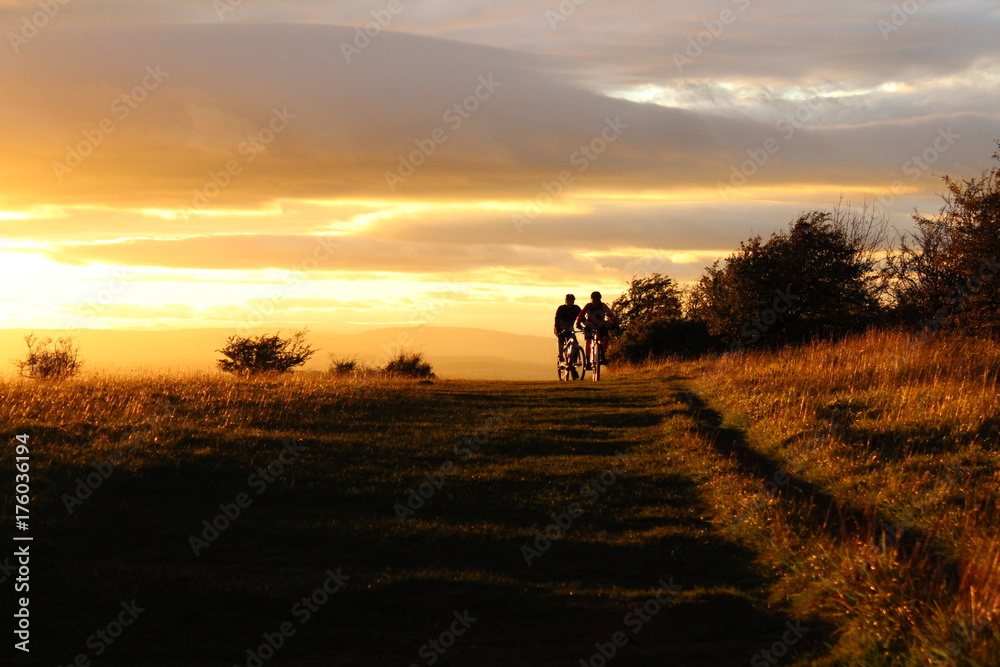 Cyclists Silhouette at Sunset