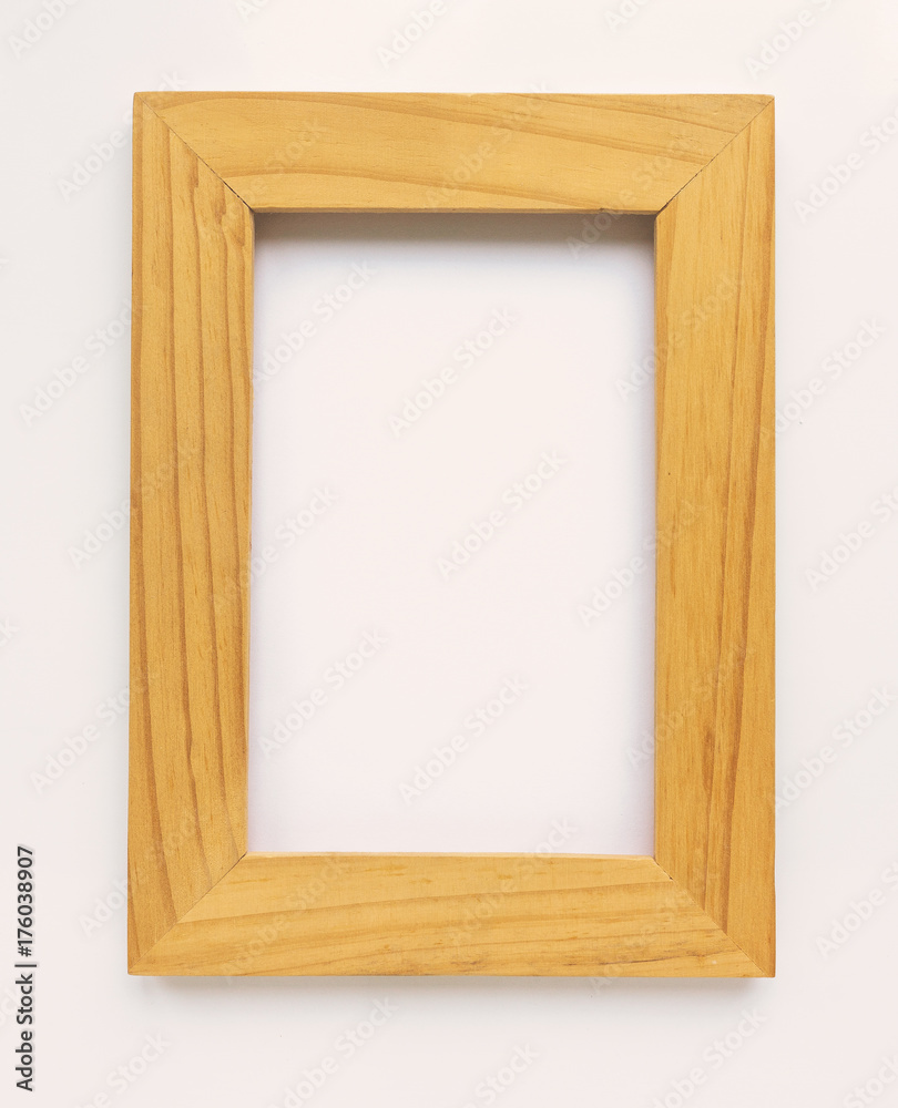 Wooden rectangular photo frame on white background. Close-up. Top view. Nobody, empty Wooden rectangular photo frame on white background. Close-up. Top view. Nobody, empty
