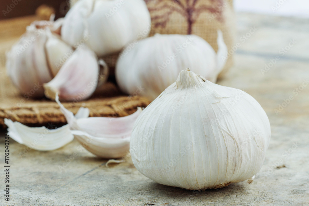 Garlic on cement and sack. Garlic on cement and sack.