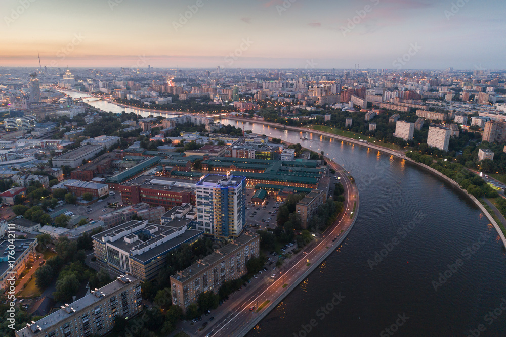 The big city and the river at sunset in the summer