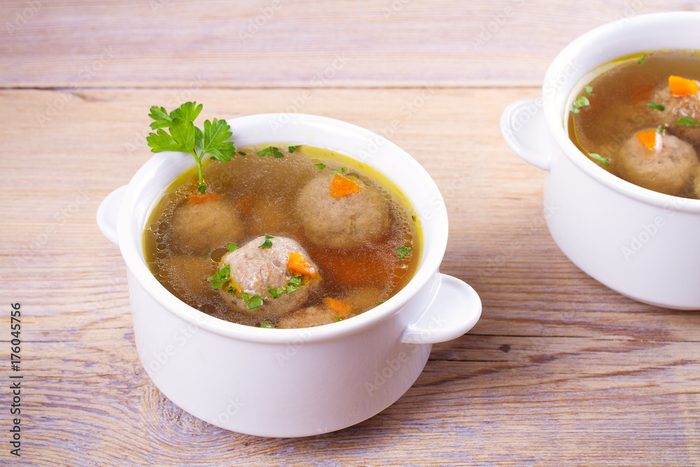 Broth with meatballs. Meatball soup