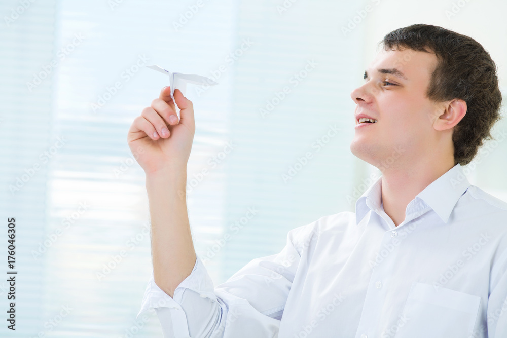 young man starts paper airplane young man starts paper airplane