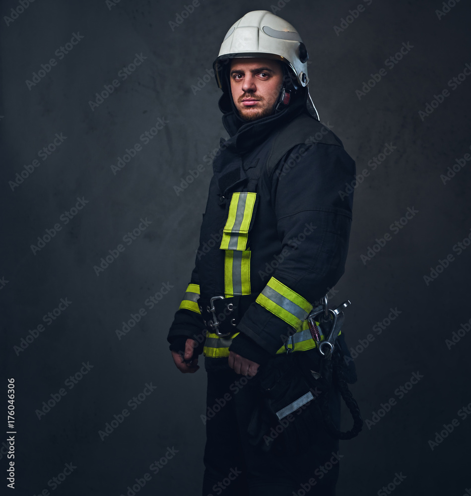 Fototapeta premium Studio portrait of firefighter dressed in uniform.