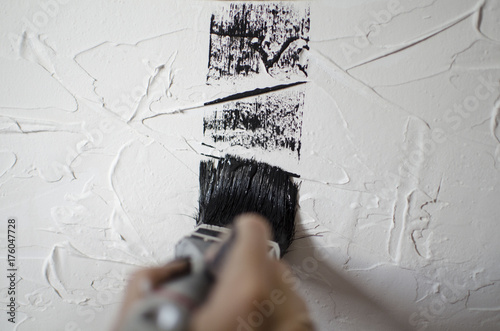 Black and white textured background. Black paint on the white free designed wall photo