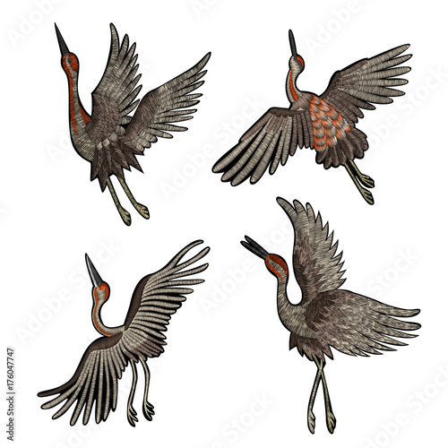 flowers cherry blossom and crane, east. traditional stylish fashionable embroidered embroidery on a black background. sketch for printing on fabric, bag, clothes, accessories and design. trend vector