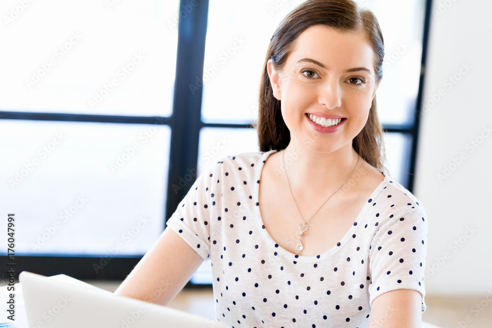 Happy entrepreneur or freelancer in an office or home Happy entrepreneur or freelancer in an office or home