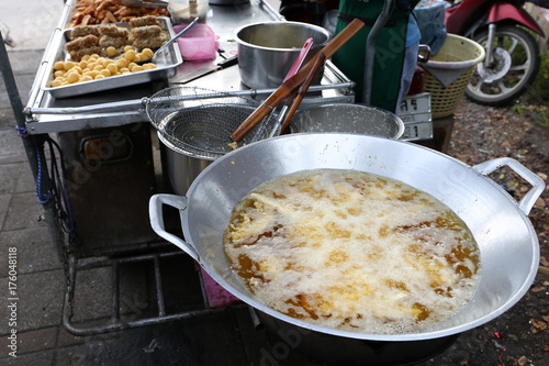 Local seller cook Deep Fried Grated Coconut Taro and Sweet Potato Thai Recipe, Thai street food