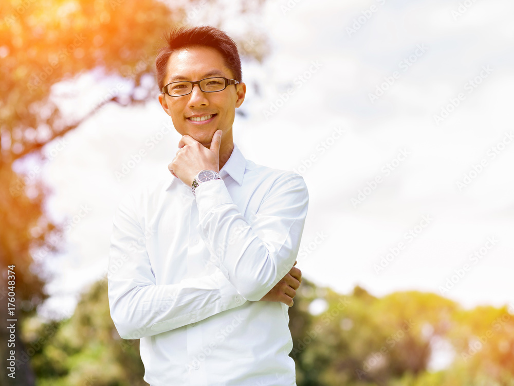 Young happy and successful businessman during his break in park Young happy and successful businessman during his break in park