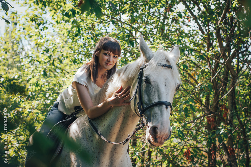 Fototapeta premium Girl and horse in the woods