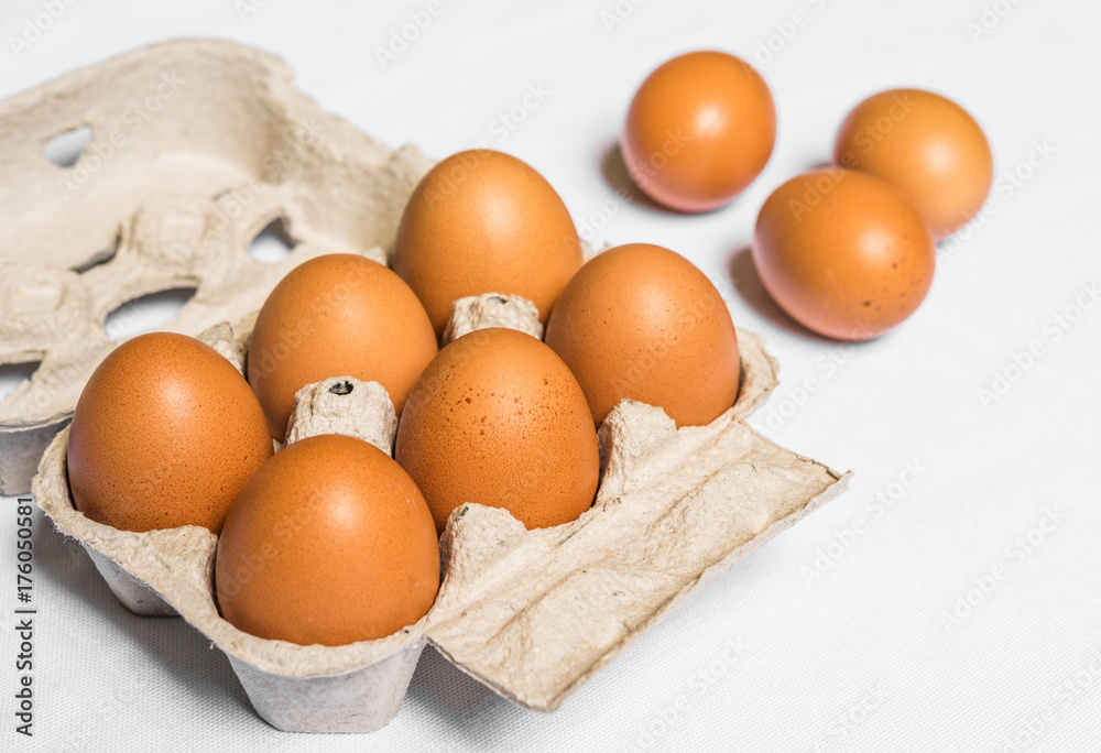 Fresh chicken eggs against white background Fresh chicken eggs against white background