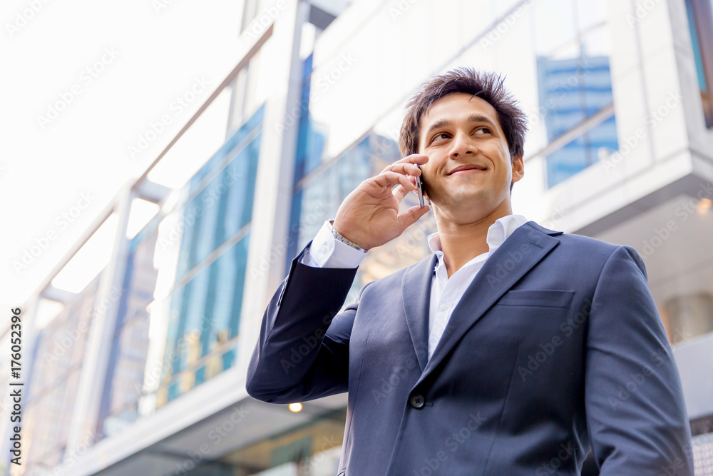 Portrait of confident businessman with mobile phone outdoors Portrait of confident businessman with mobile phone outdoors