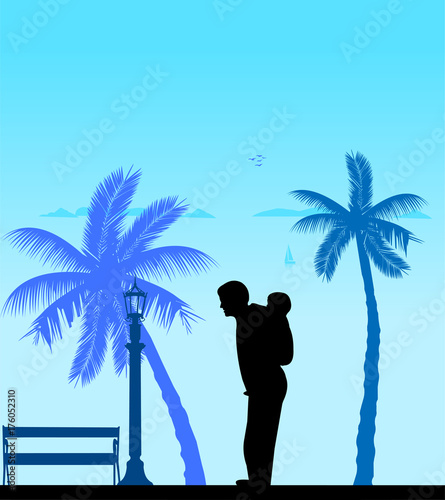 Father carrying a child piggyback on the beach, one in the series of similar images silhouette
