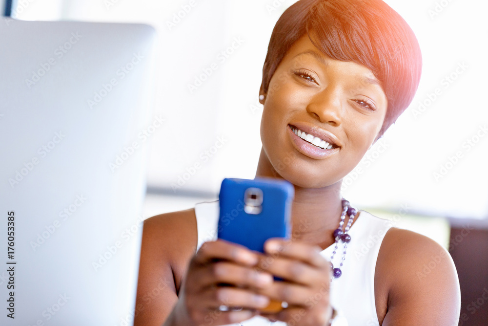 Portrait of smiling business woman with mobile