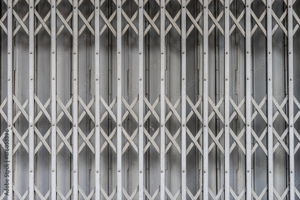 Folding metal door gate Thai vintage style. Pattern texture surface and background of iron plate zinc sheet metal steel door Stock Photo Adobe Stock