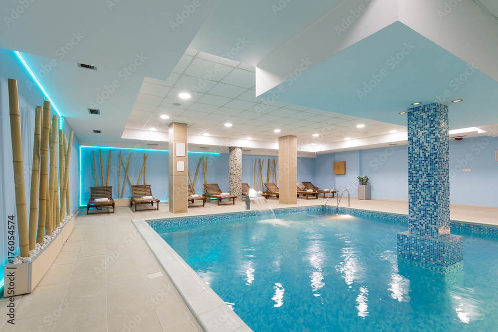 Indoor swimming pool in hotel spa center - obrazy, fototapety, plakaty 