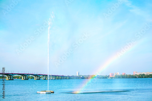 Beautiful View of the river Dnieper with high fountain and rainbow . Dnipro city, Ukraine photo