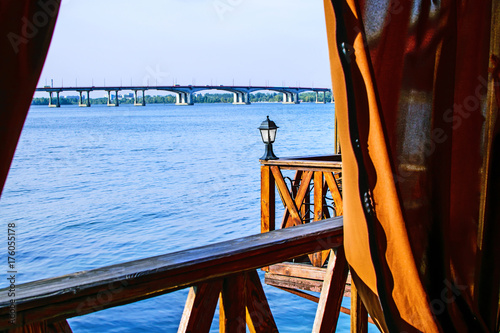 Beautiful View of the river Dnieper from a restaurant at an autumn day. Dnipro city, Ukraine photo