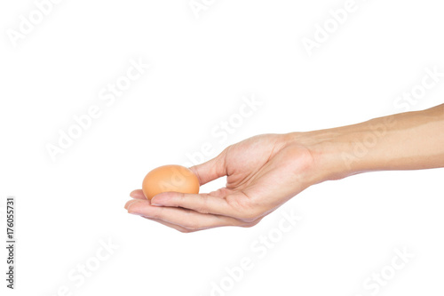 A man hand holding raw chicken egg isolated on white background with clipping path.