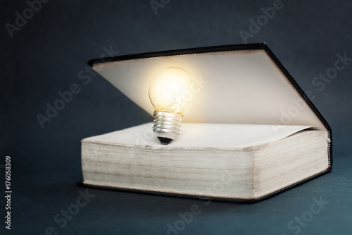Light bulb and book